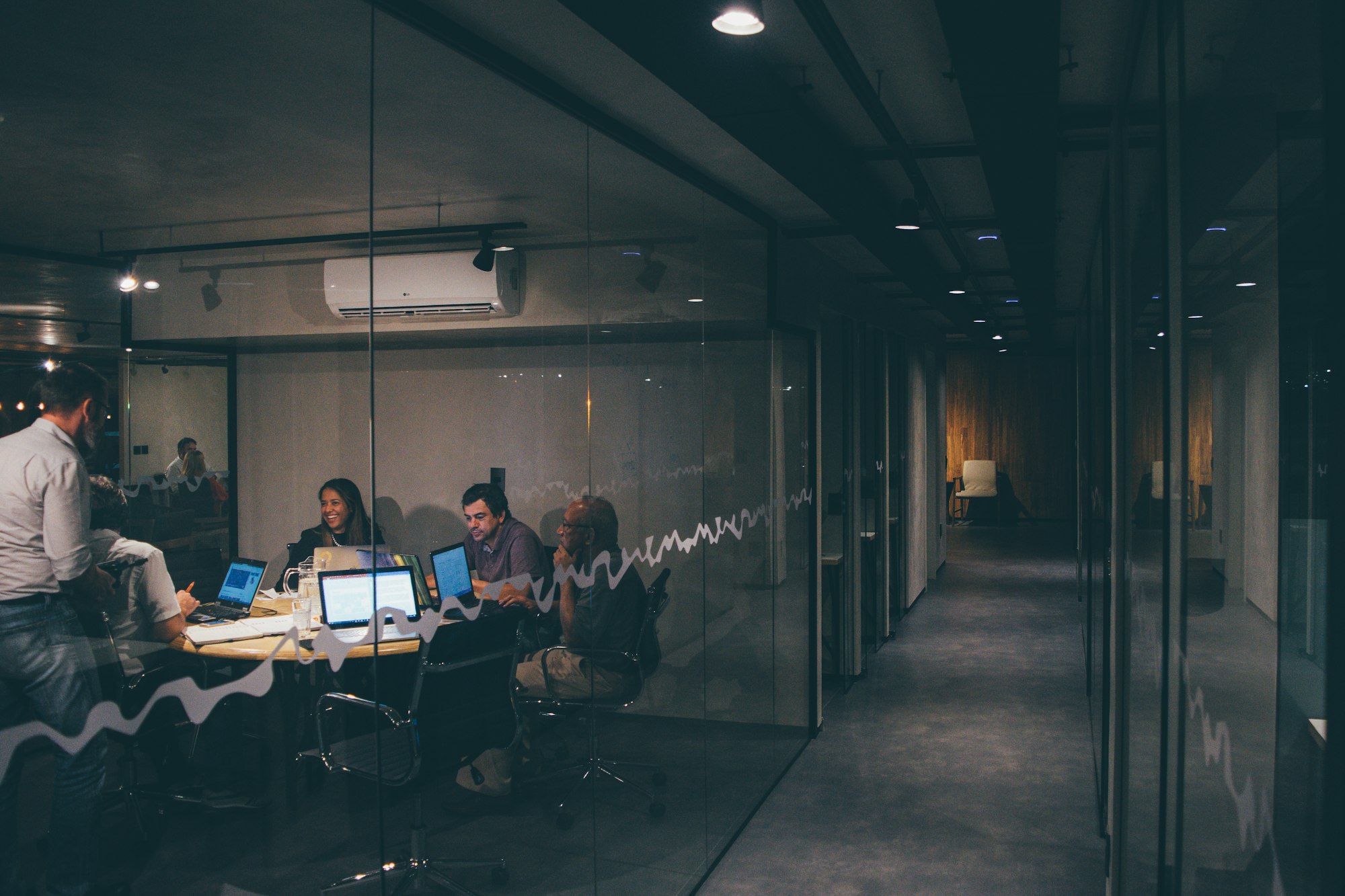 A dark office behind glass